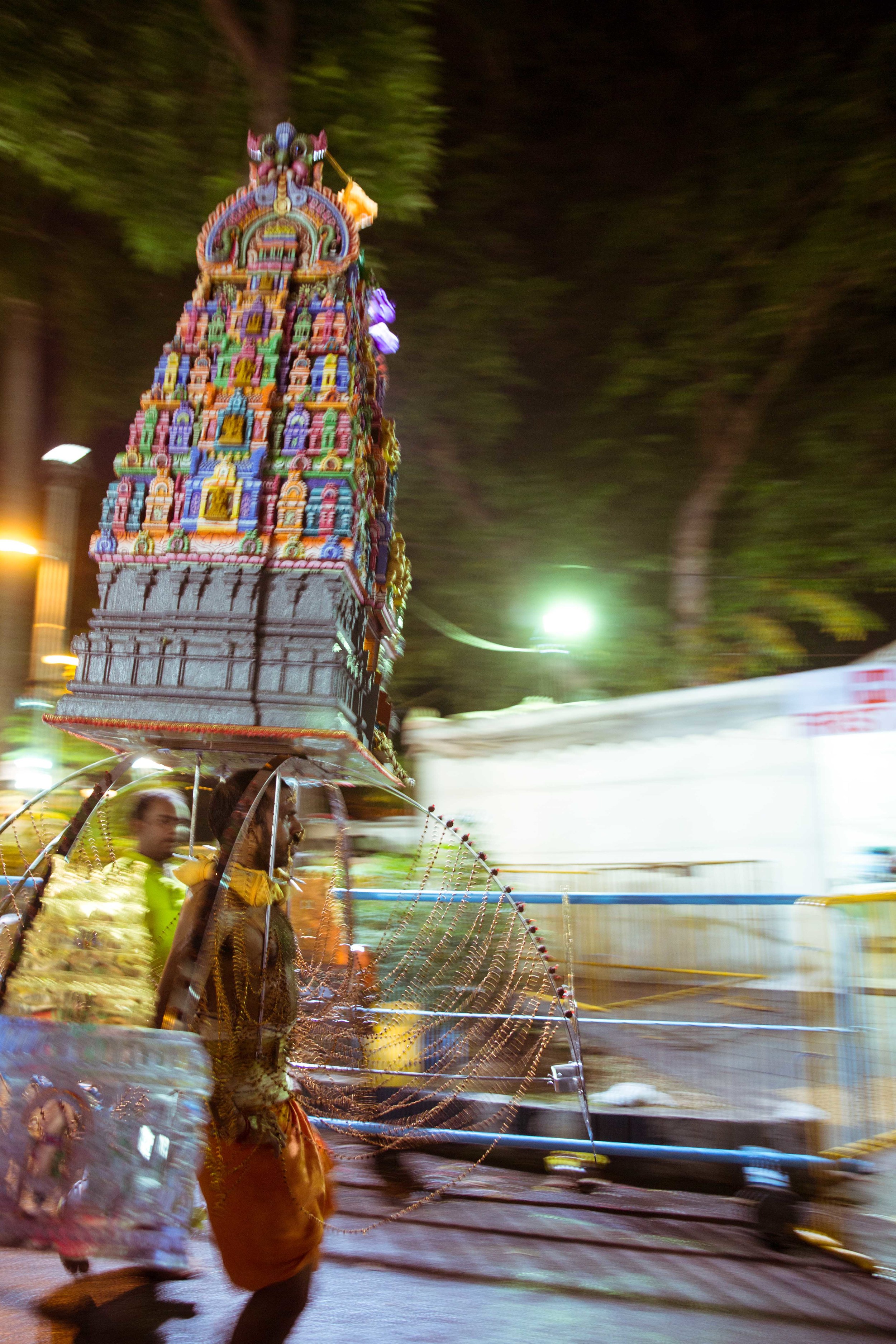  A devotee walking towards the Kavadi dismantling area. 