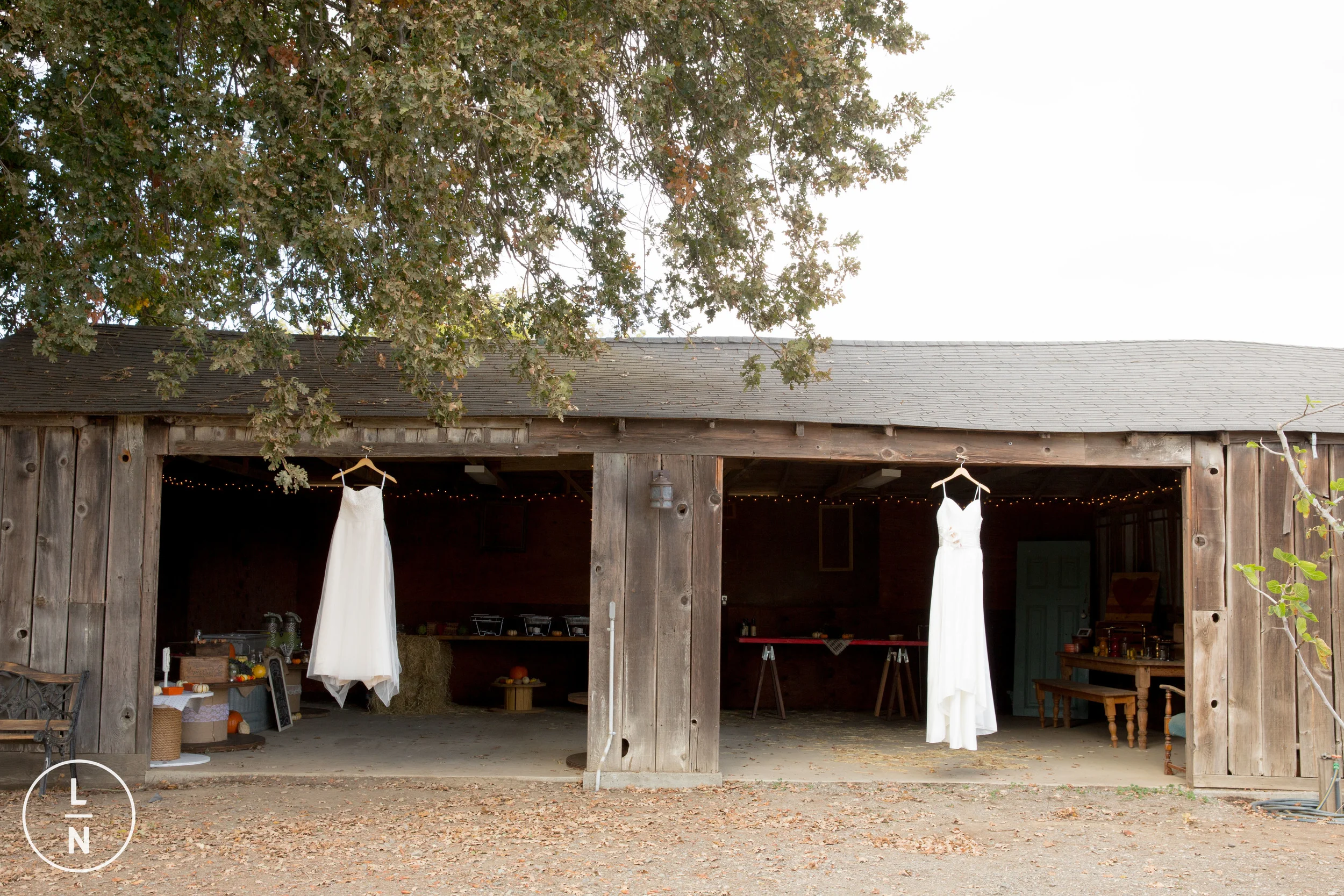 Loved both their gowns and how it looked against the weathered barn which was the spot for all the yummy BBQ guests were going to enjoy later.