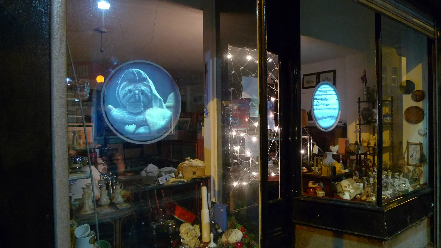 House of Bread 2010 Video installation in a second-hand shop, Elizabeth's Place (an ex-bakery), Bristol. Films exploring the myths and mysteries of bread and bread-making were projected onto circular screens. Small objects made of bread, such as skulls and little houses, were placed in the window amongst the general objects for sale. Commissioned by Illuminate Bristol.
