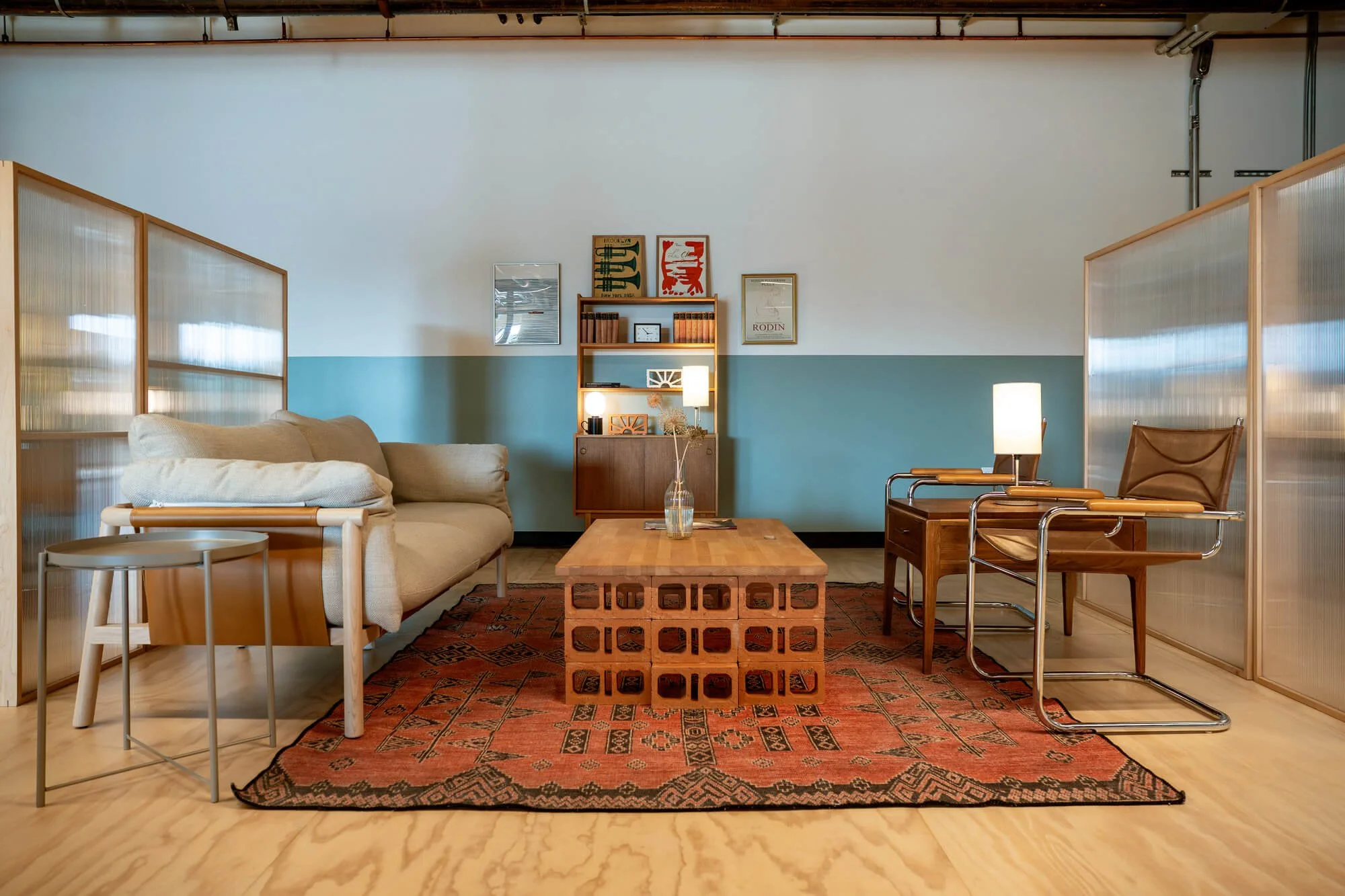 A soft seating area with a love seat, two chairs, and a coffee table
