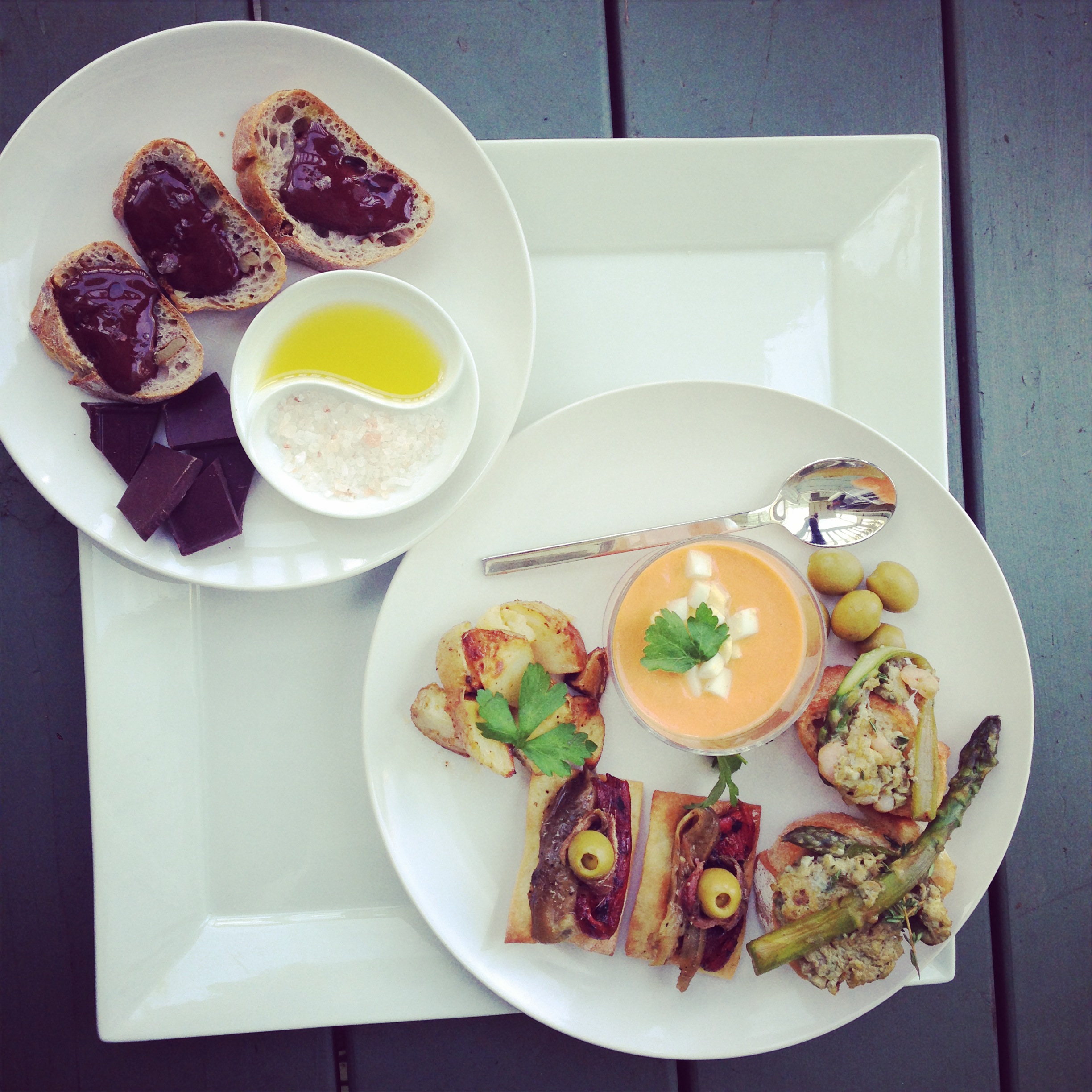 Bread with chocolate, olive oil and salt; salmorejo; marinated olives; pincho with asparagus and baby shrimp scramble, escalivada with anchovies and olives, patatas bravas