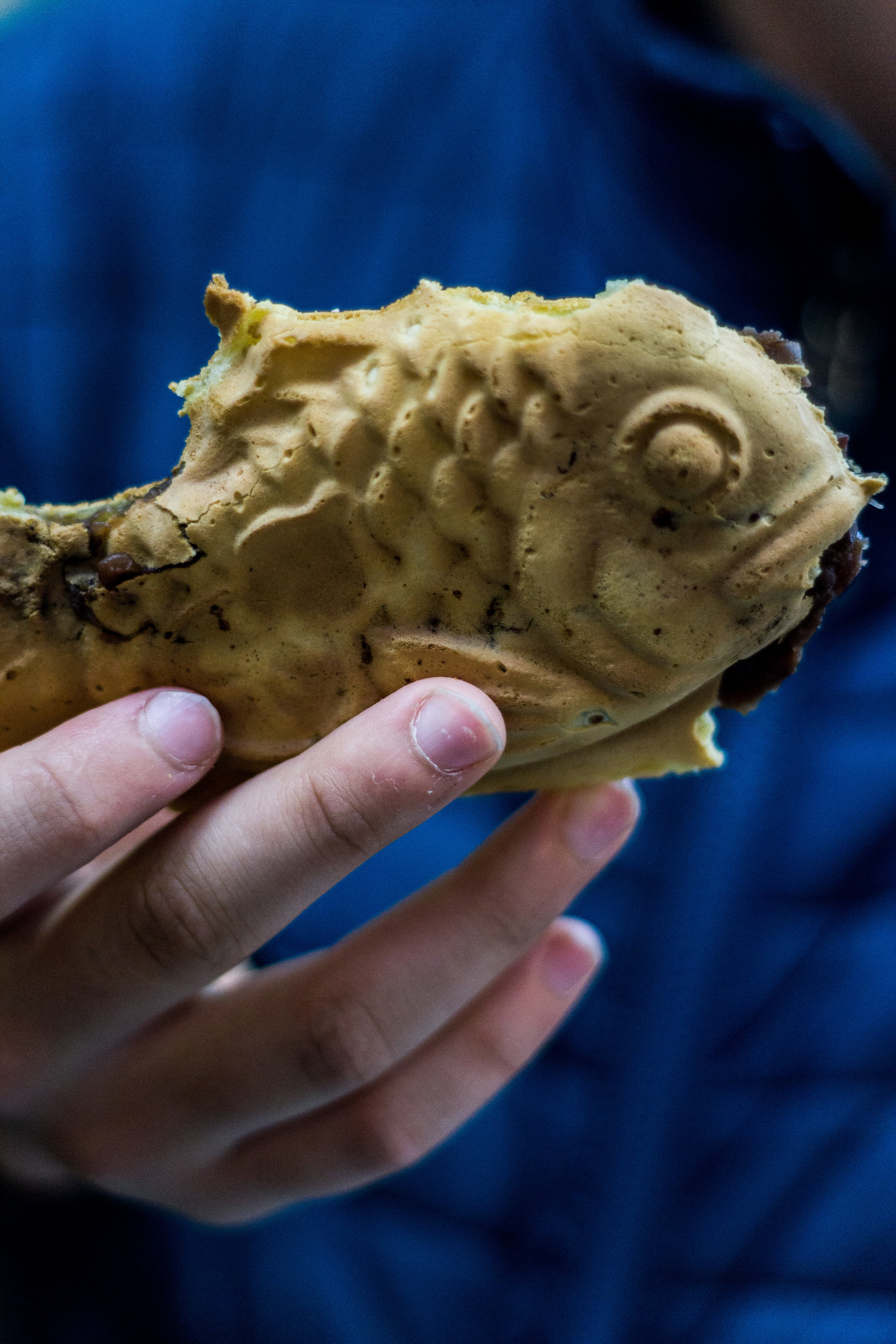 Taiyaki , a fish-shaped waffle filled with sweet red bean paste.
