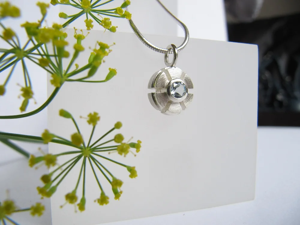 Mechanical flower pendant, topaz
