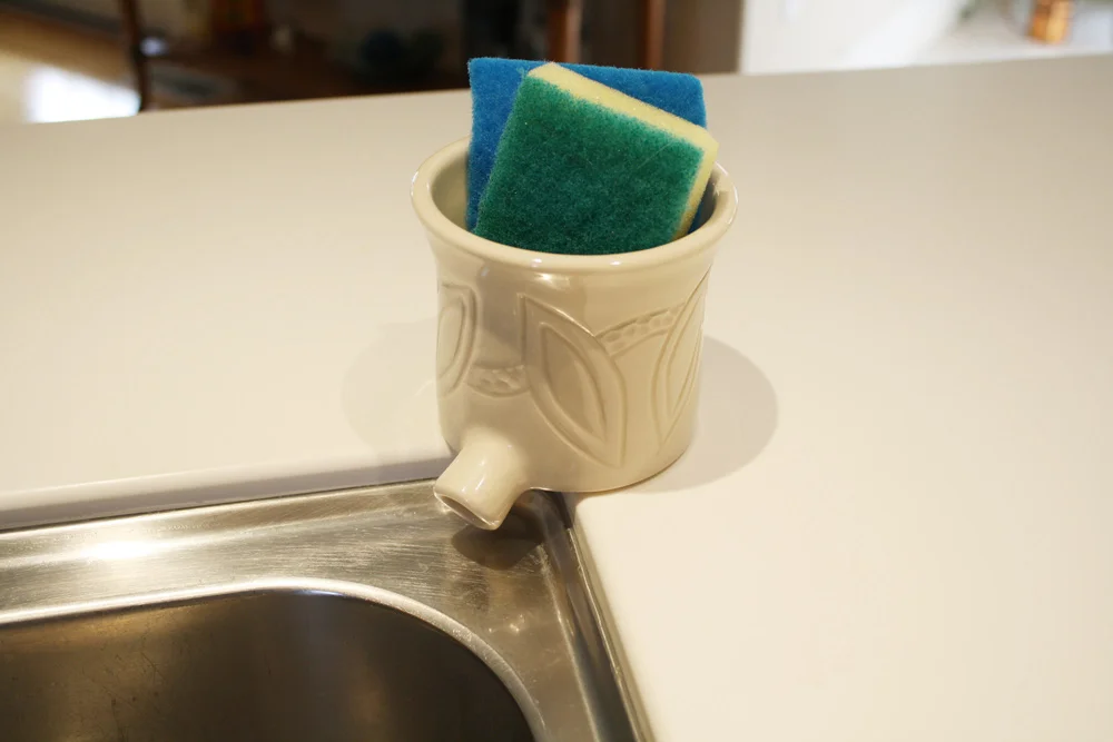 white carved sink pot