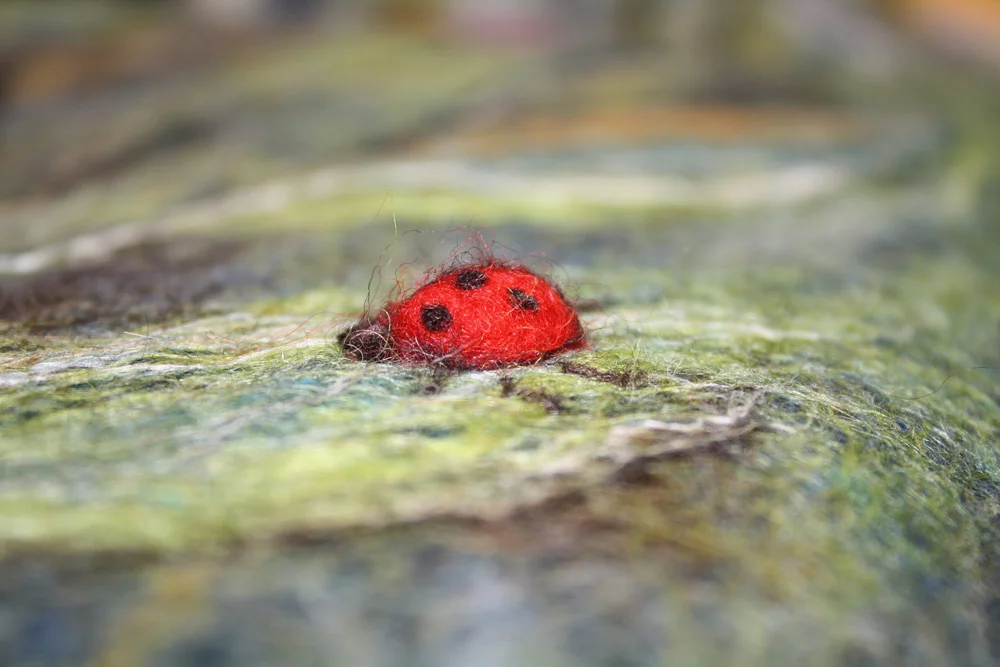 ladybug on previous bellflower tapestry above to show the relief of the ladybug