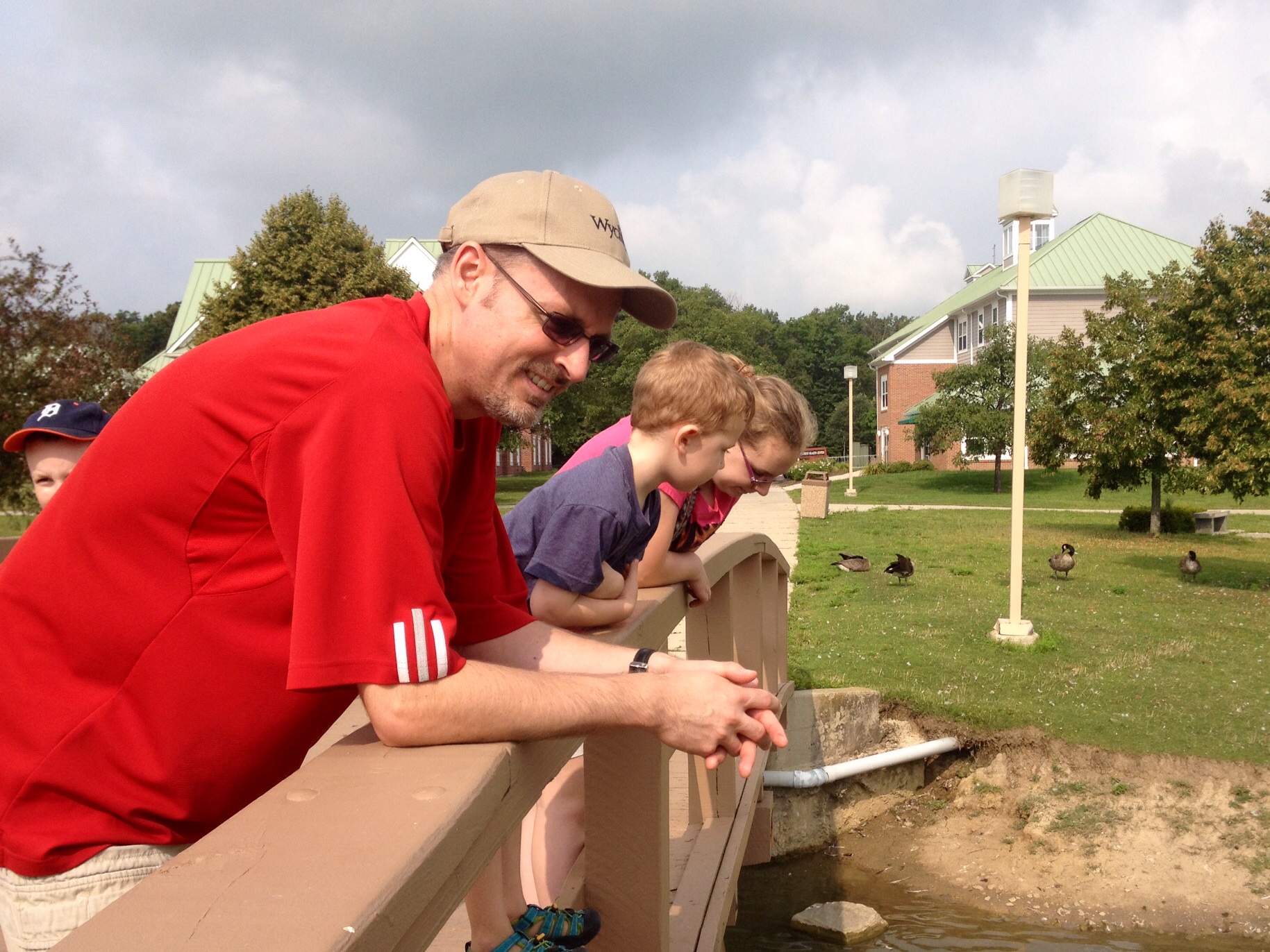 David, Banner, and Olivia stare and wonder whether there are more fish or ducks.