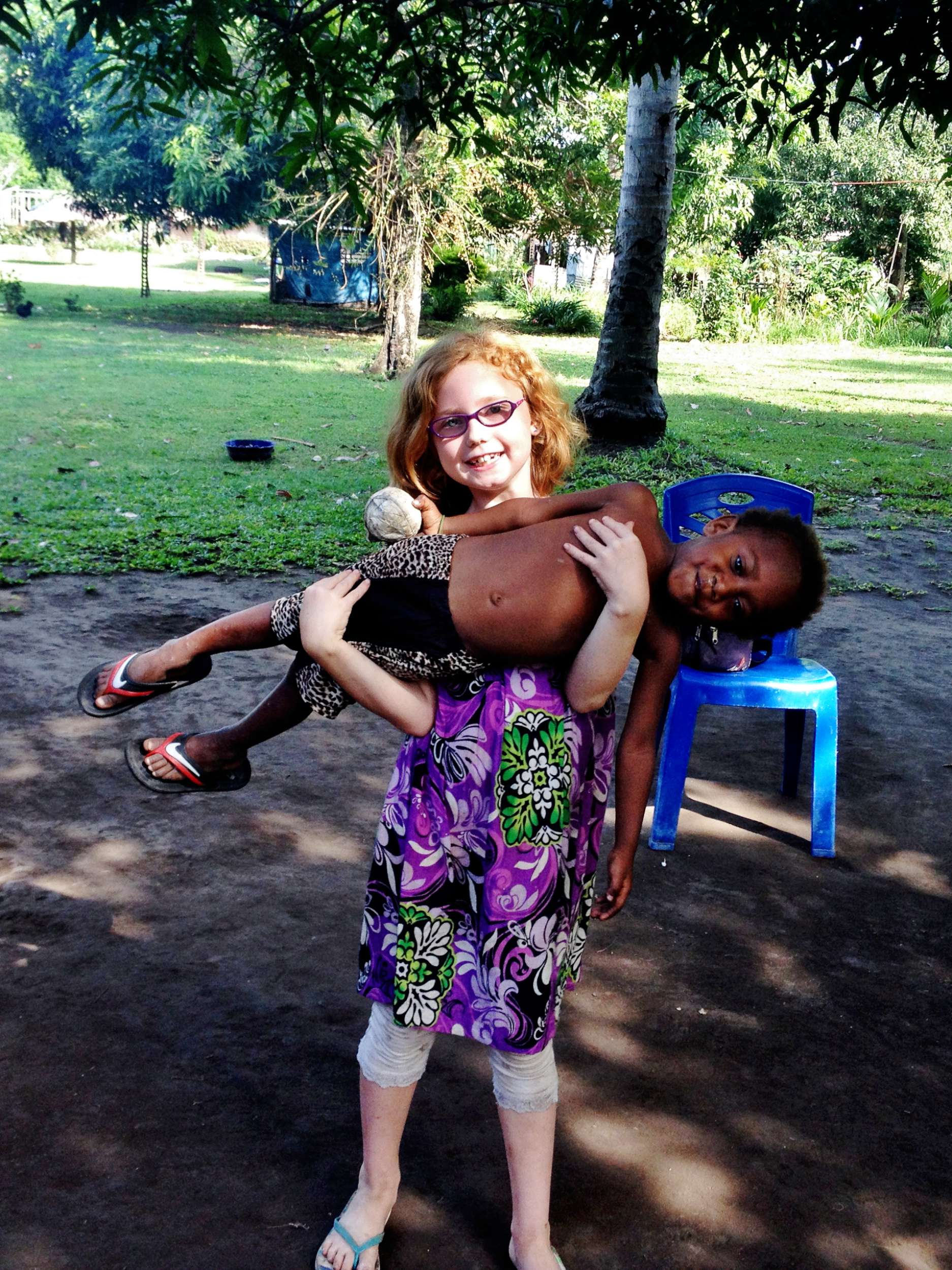 Nori took great joy in carrying Mary around whenever she would let her.