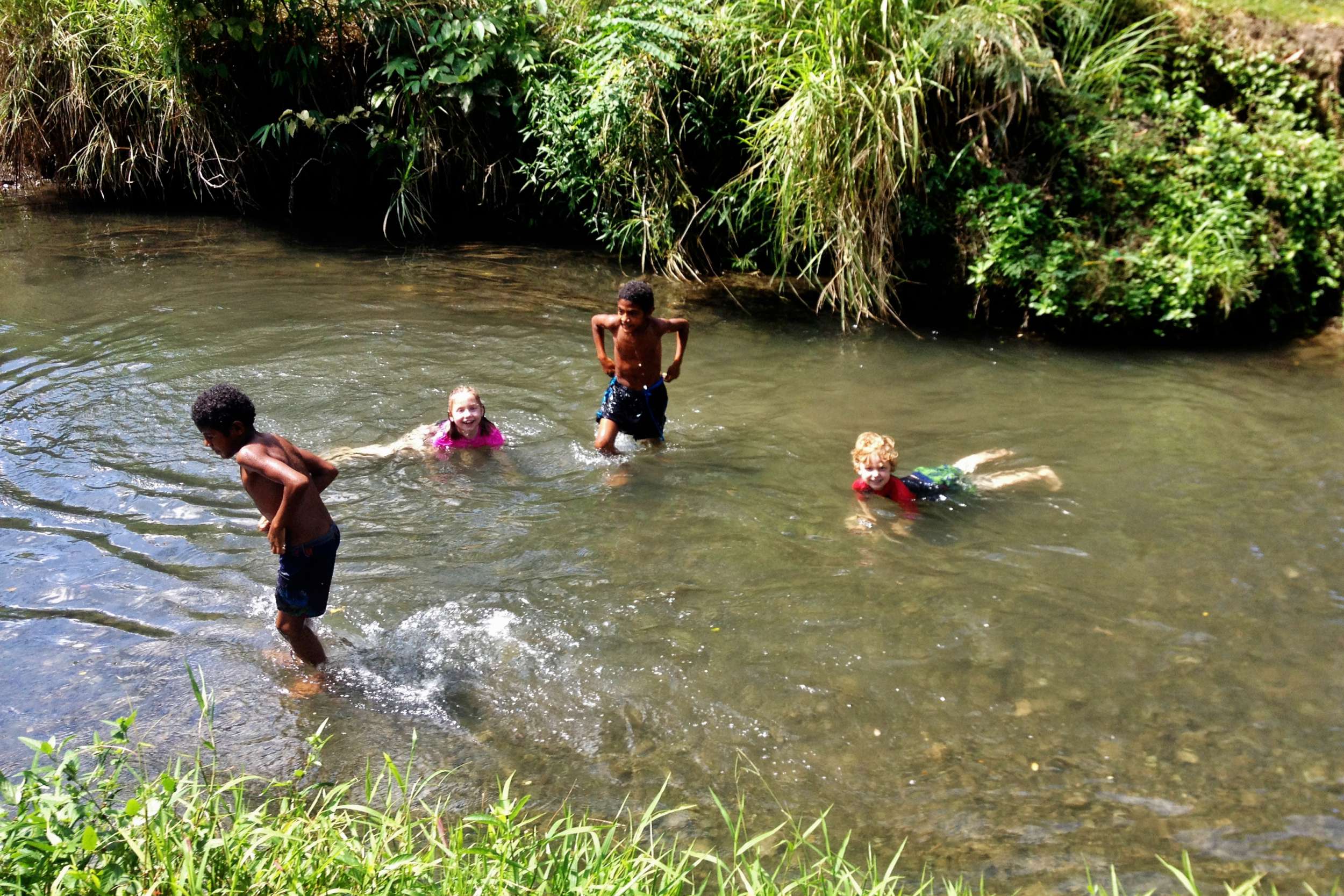 We took a PMV to "Clean Water" which was this swimming hole about 15 minutes away. There were about 30 of us that went—all of them our family!