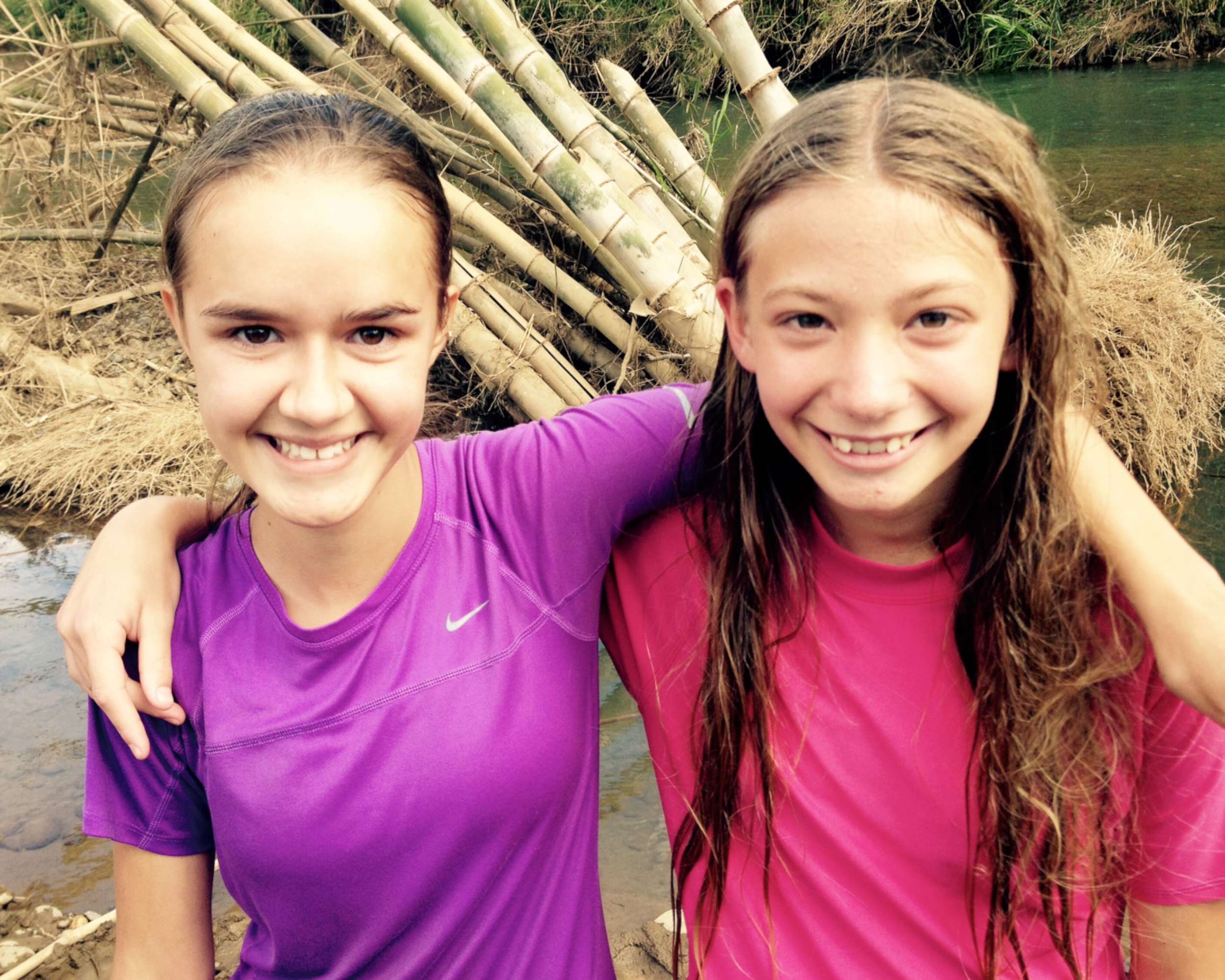 Two of Kristi's 7th-grade girls that were baptized in the river!