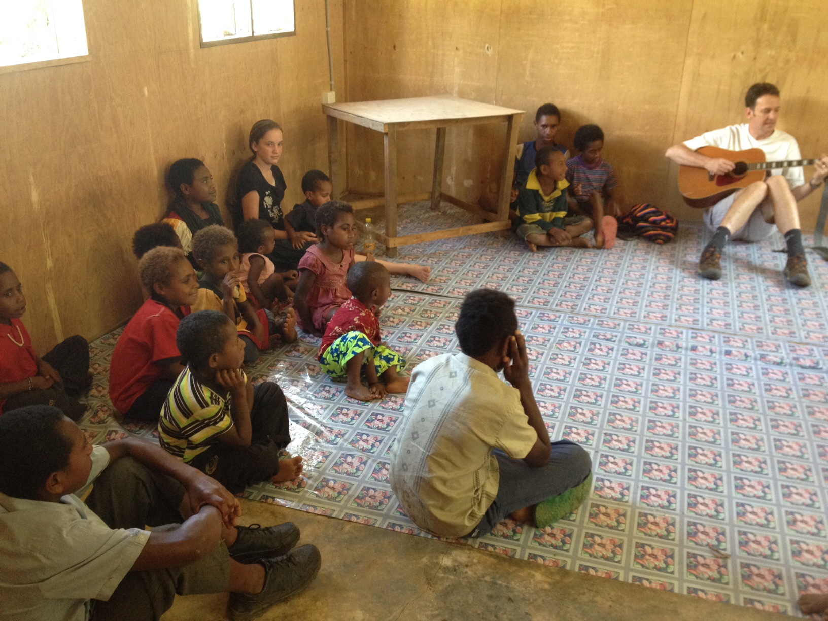  Dr. Mills leads the Sunday school class and is helped out by his son and daughter. 