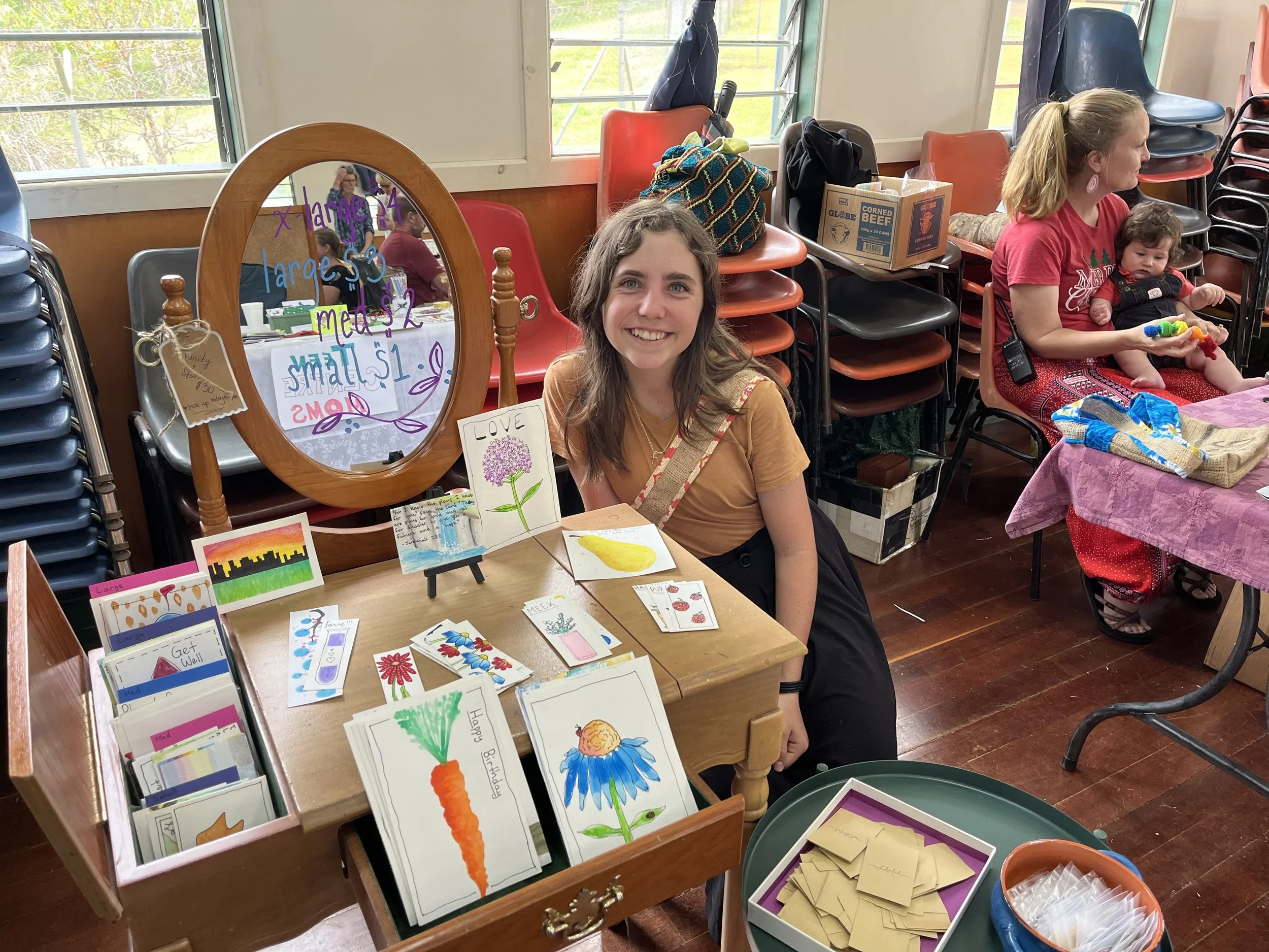  Millie selling her many many watercolors that she made for our recent craft fair. 