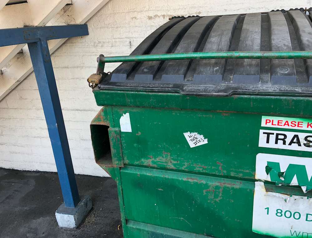 One of the locked dumpsters
