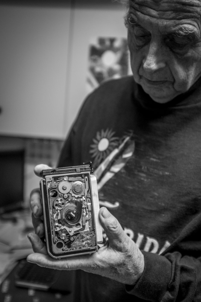   Horst Wenzel shows me the inner workings of the film advance system on a Rolleiflex camera that's over 50 years old.    Fuji X100T 9.16     