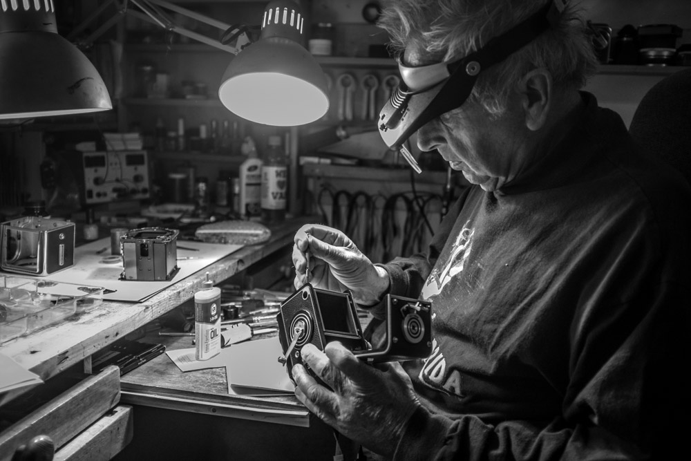   Horst Wenzel adds a small drop of lubricant to one of the rollers in my Rolleiflex 2.8C.    Fuji X100T 9.16     