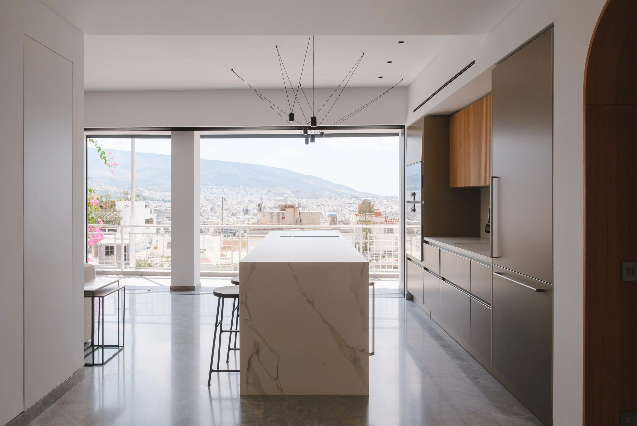  The renovation of the apartment involved a complete refurbishment. Located just below Lycabettus Hill in the center of Athens, the flat enjoys captivating views of both Lycabettus and Mount Hymettus.  The relatively compact 90 m² floor plan presente