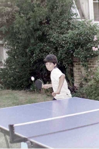 Alex demolishes Danny in a game of ping pong in the garden