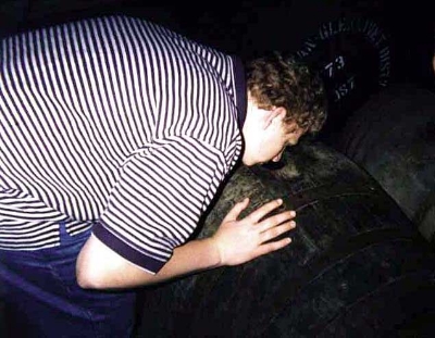 Danny can't wait for his first taste, so he tries to snort directly out of the cask.