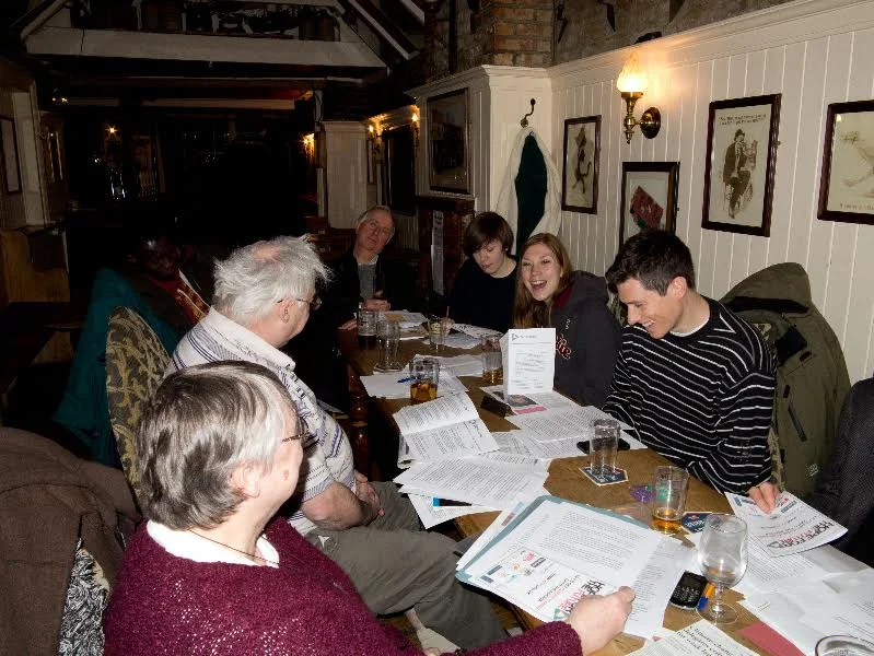 Carrie with a group from her Parish holding a climate write-in to write letters to Justine Greening.