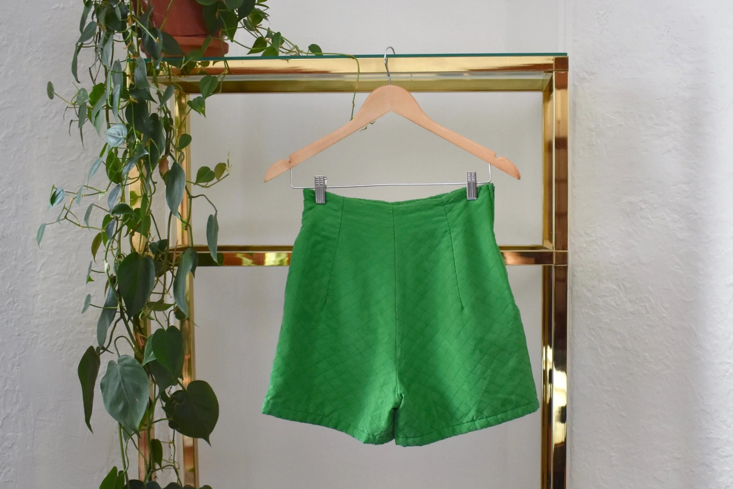 "i’m obsessed with these green silk short shorts, love the high waist, they’d look awesome dressed up or down. Someone needs to buy these."