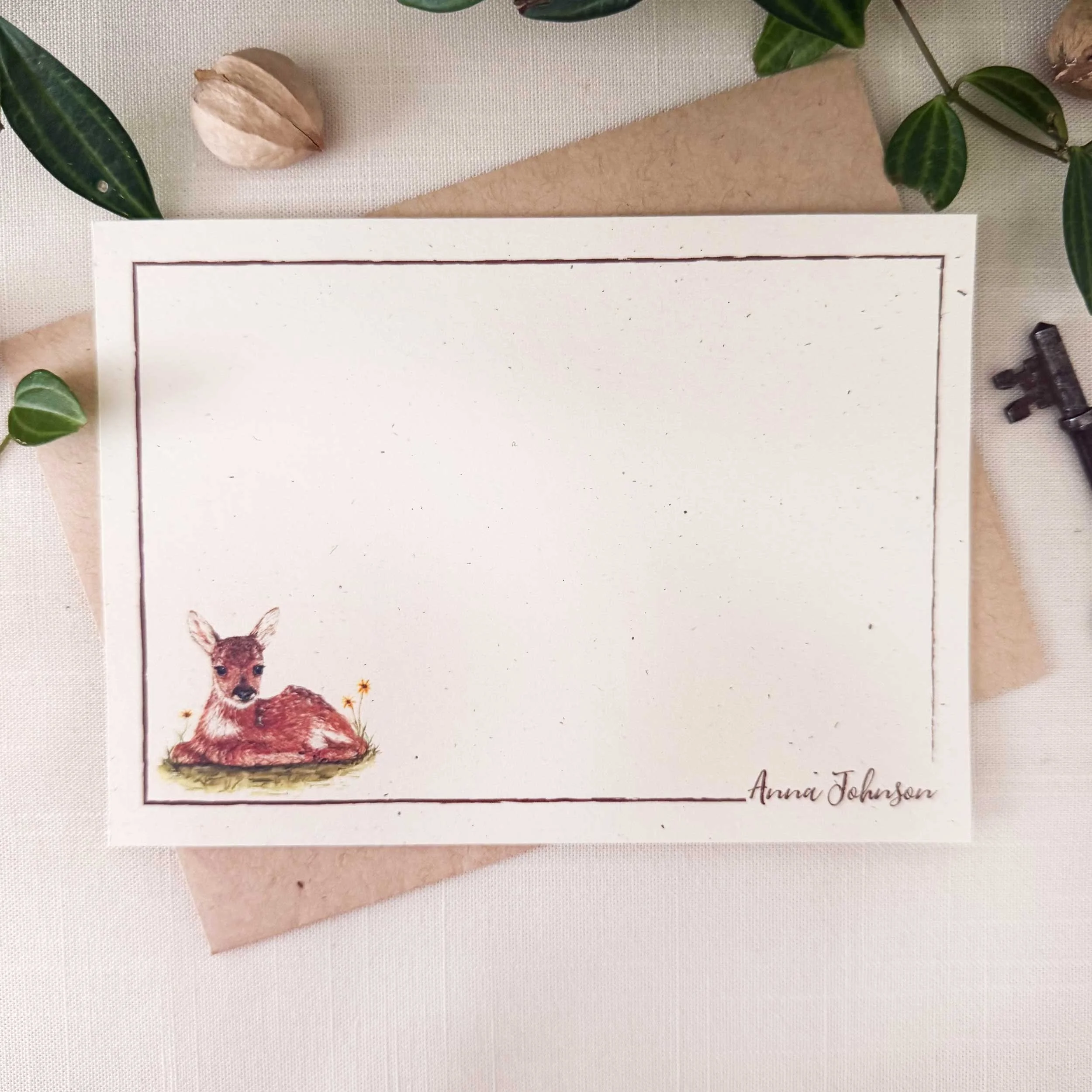young-fawn-laying-down_notecard_1.jpg