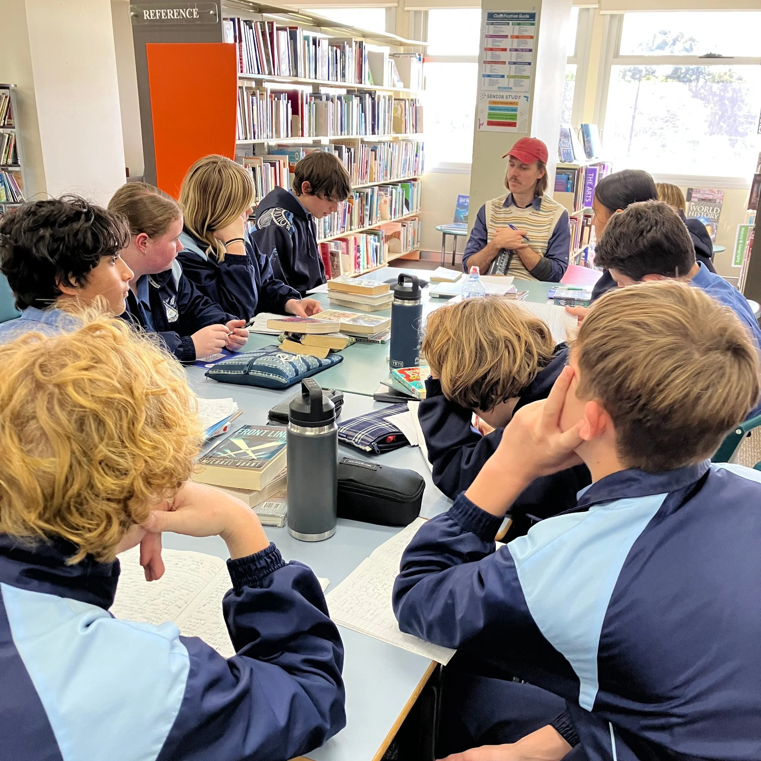Lachlan teaching a playwriting workshop to students
