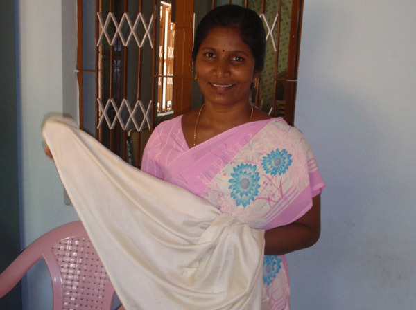 Sudha while at work in the Nano Nagel tailoring unit, 2009