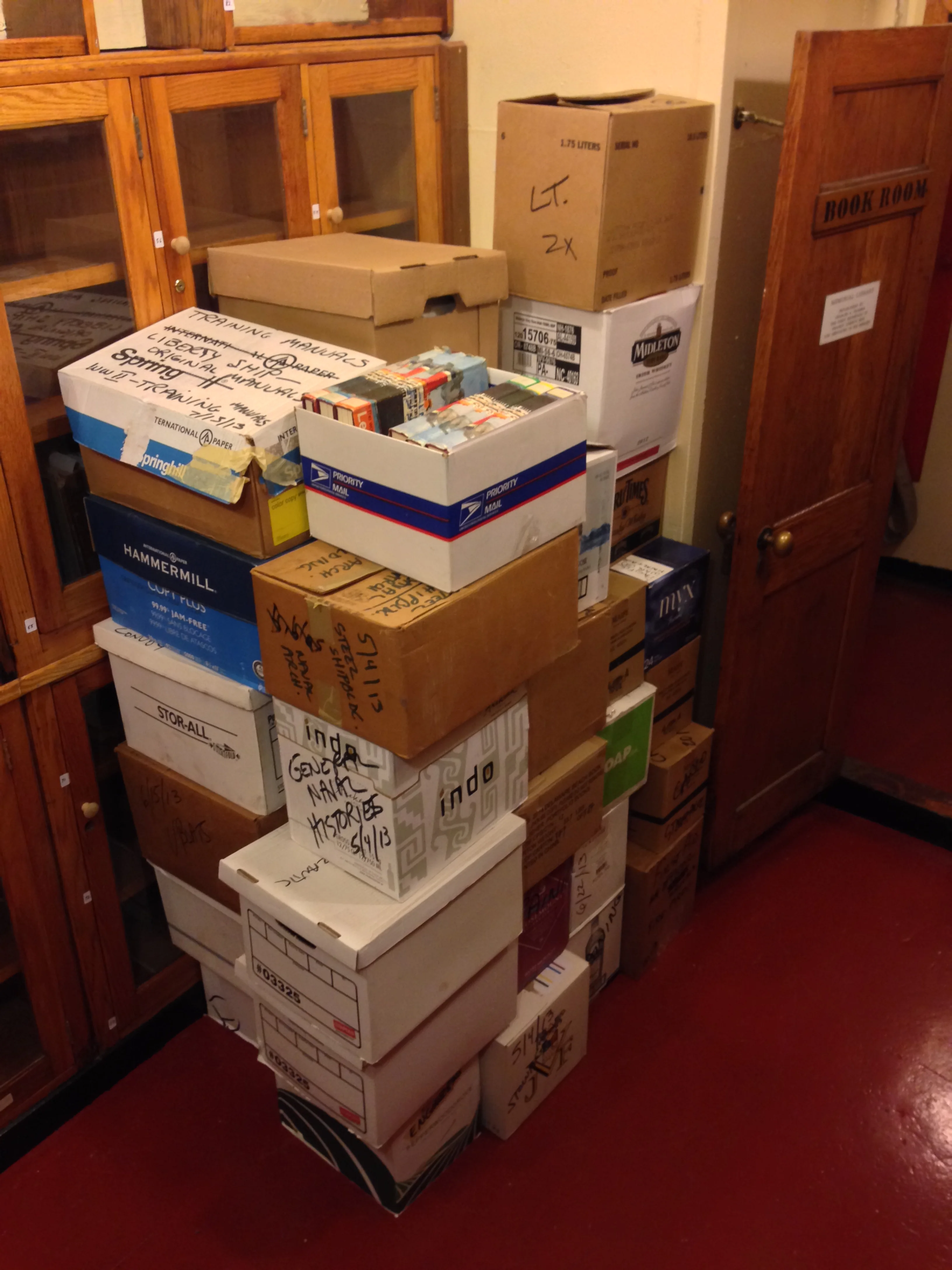 The most recent set of books brought in to the library, ready to be inventoried. Talk about having your work cut out for you!