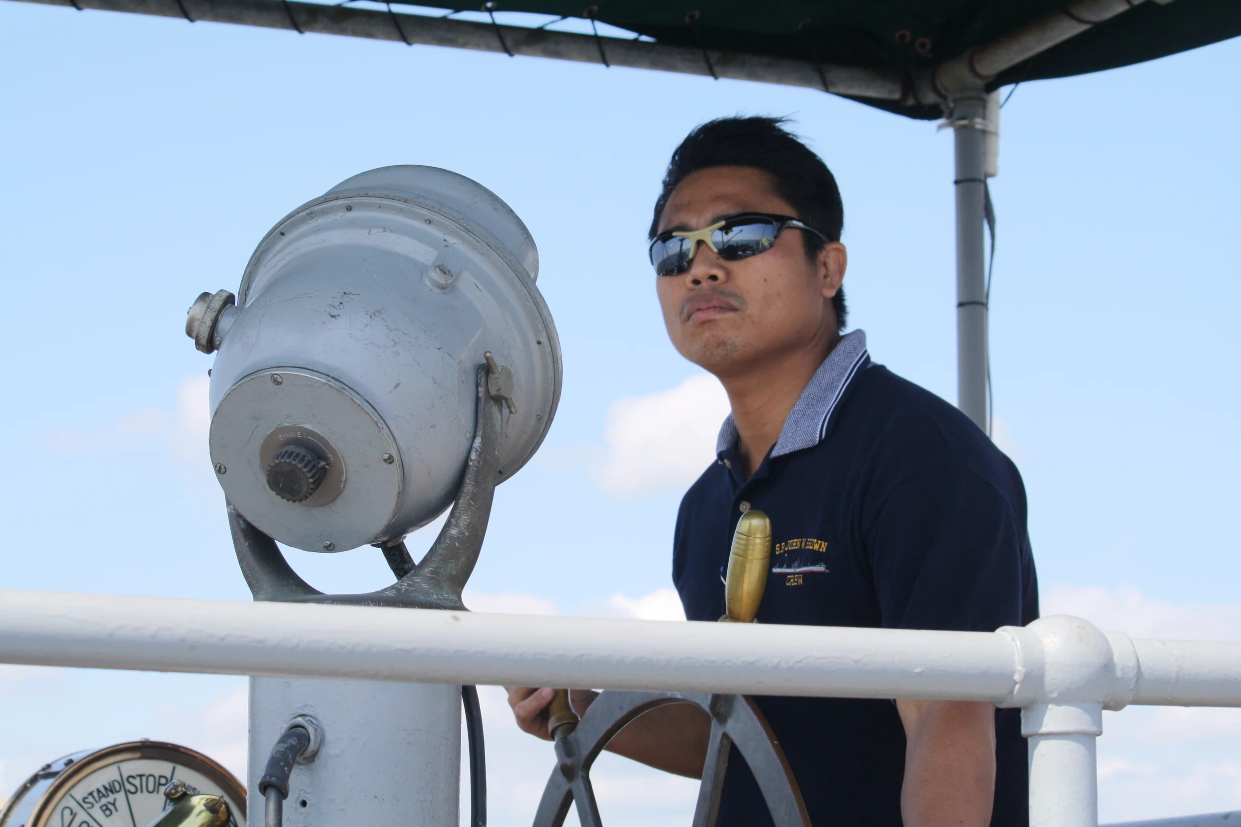 AB Felix at the wheel on the BROWN's flying bridge in 2011.