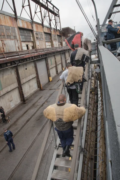 The team from Prince Georges Country brings the suits for the decoys on board. Several of the officers took turns being the decoy as part of the training.