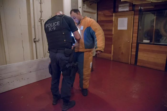 The decoy is checked to make sure his suit is properly fastened. Can't have any accidents on the ship when our medical team is not on-board!