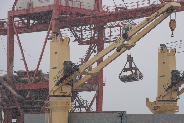 No time is wasted and as soon as the freighter is tied up the unloading begins.