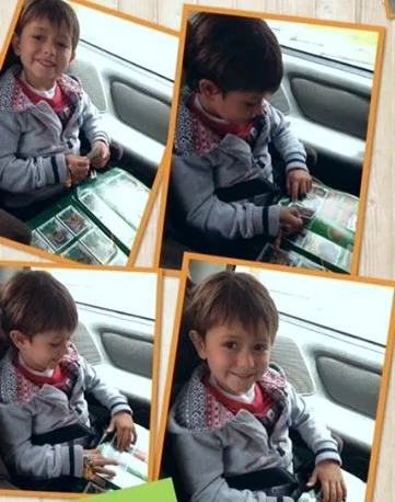 My Godson, Jack, proudly displays his completed album with much relief to his parent's time and pocketbooks!