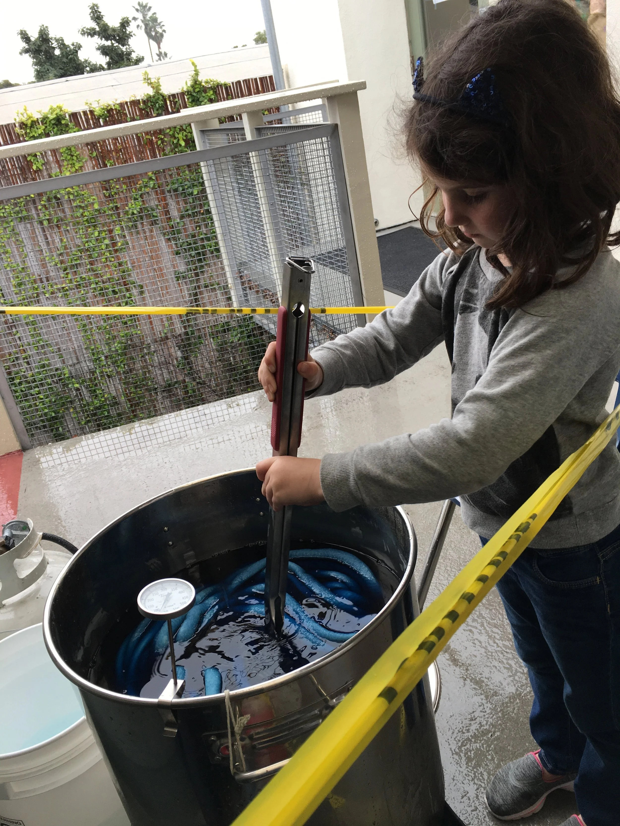 This shows Nora stirring the pot during the initial heating of the dye bath.