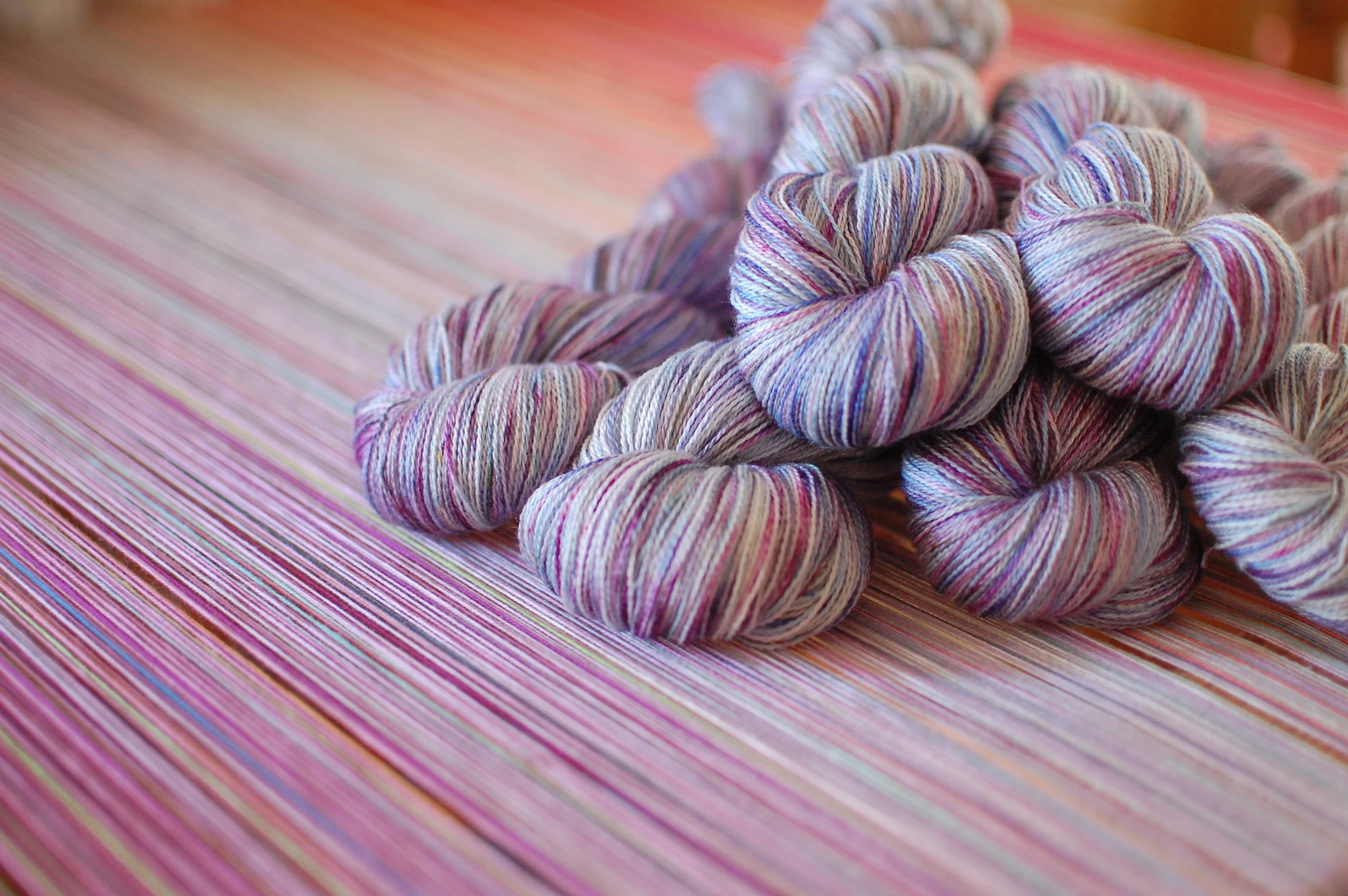 superwash wool/mulberry silk - dyed to match the warp