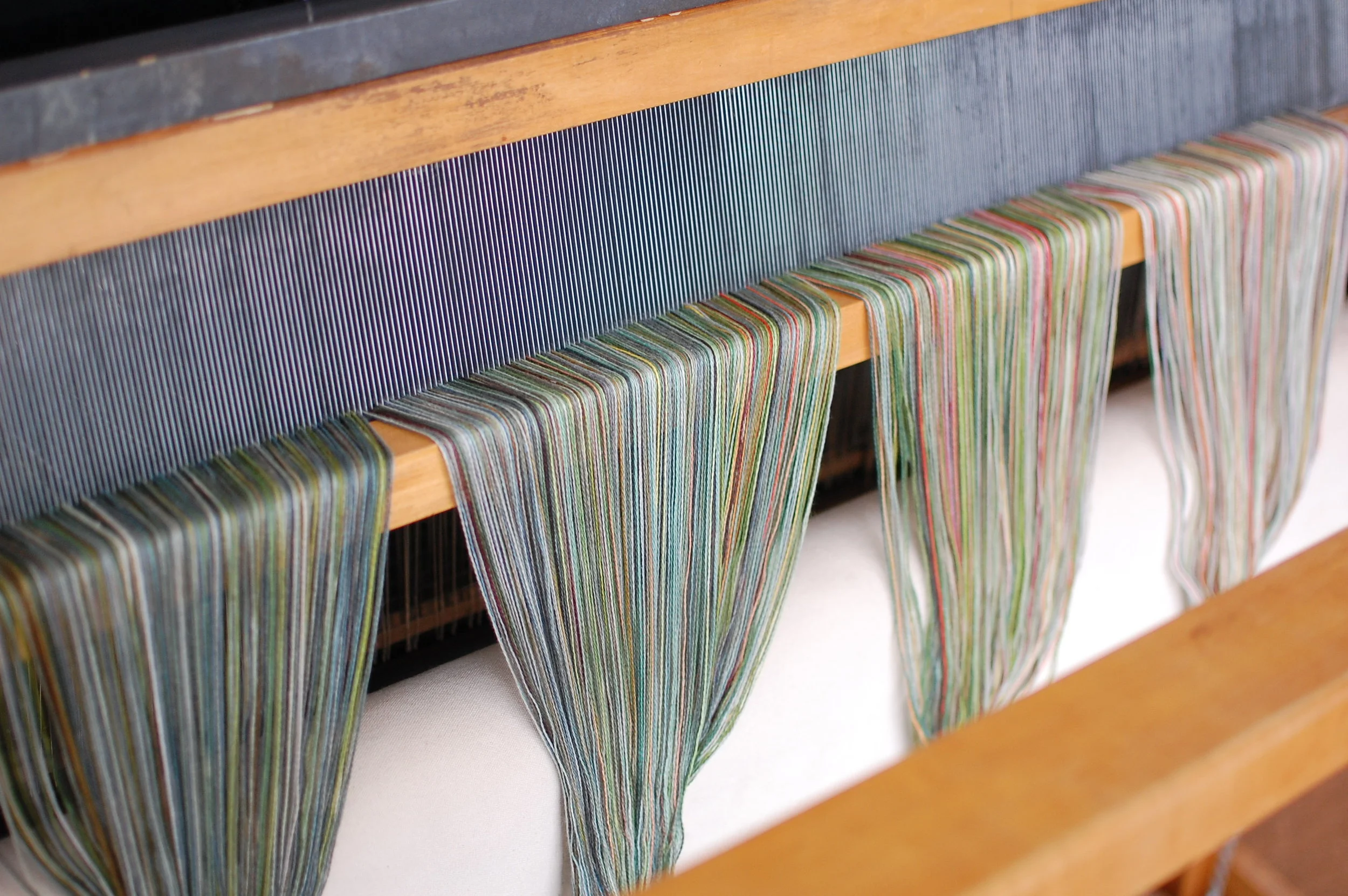a view at the front of the loom after sleying the reed