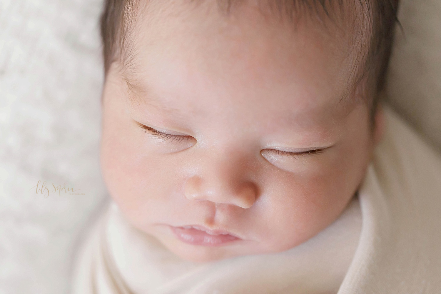  Close up image of a sleeping Asian newborn boy's face.&nbsp; 