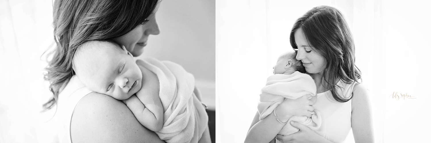 New Atlanta mother holding newborn baby girl up on her shoulder in Atlanta