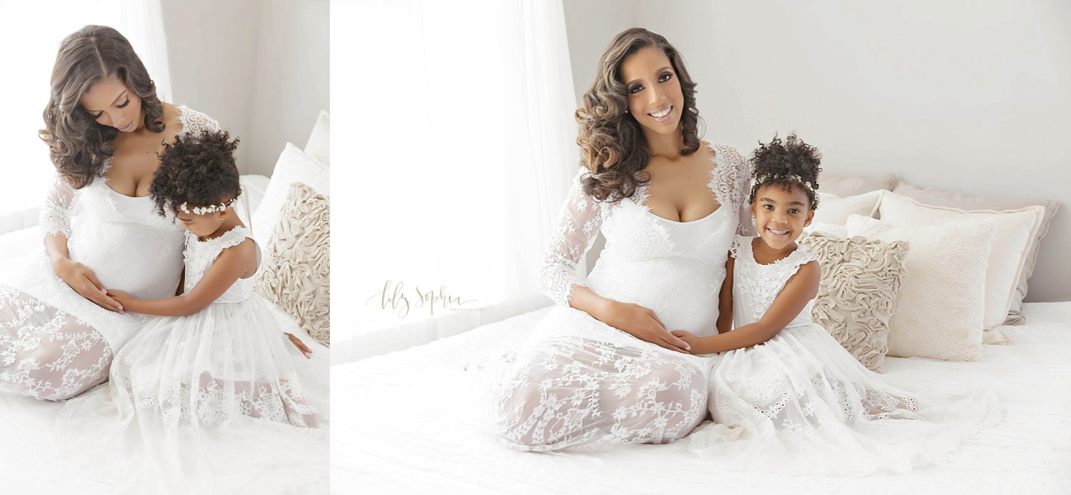 Natural light studio images of pregnant black mother and little girl sitting on bed in Atlanta