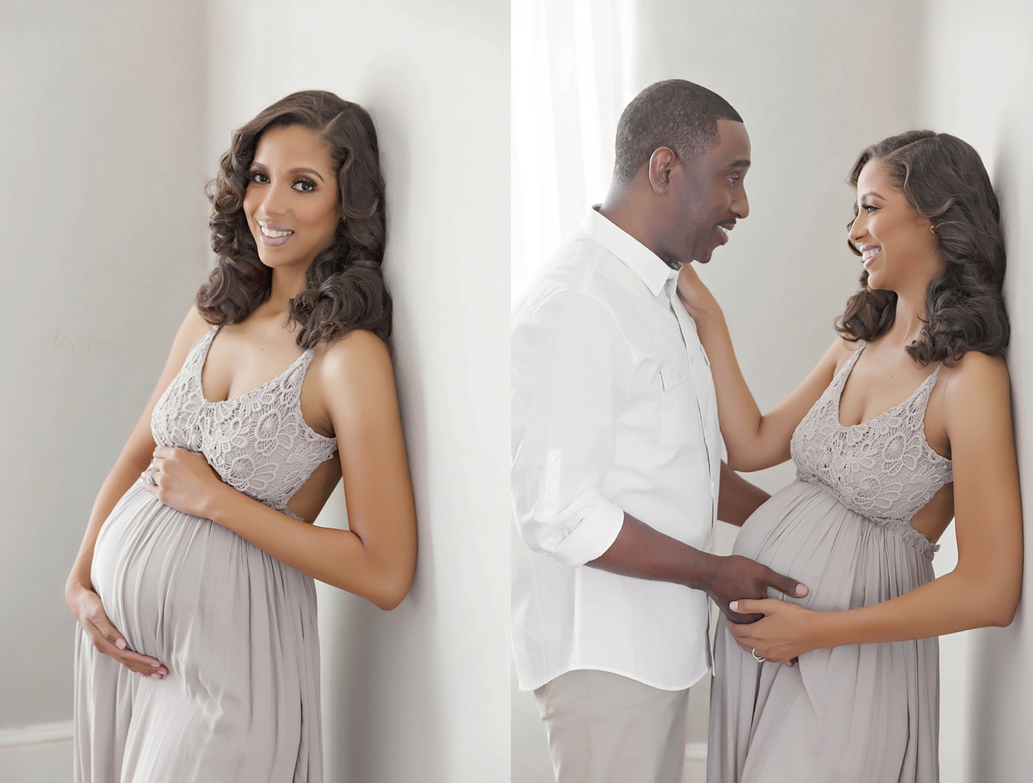 Happy expectant African American couple smiling and looking at each other in Atlanta natural light studio