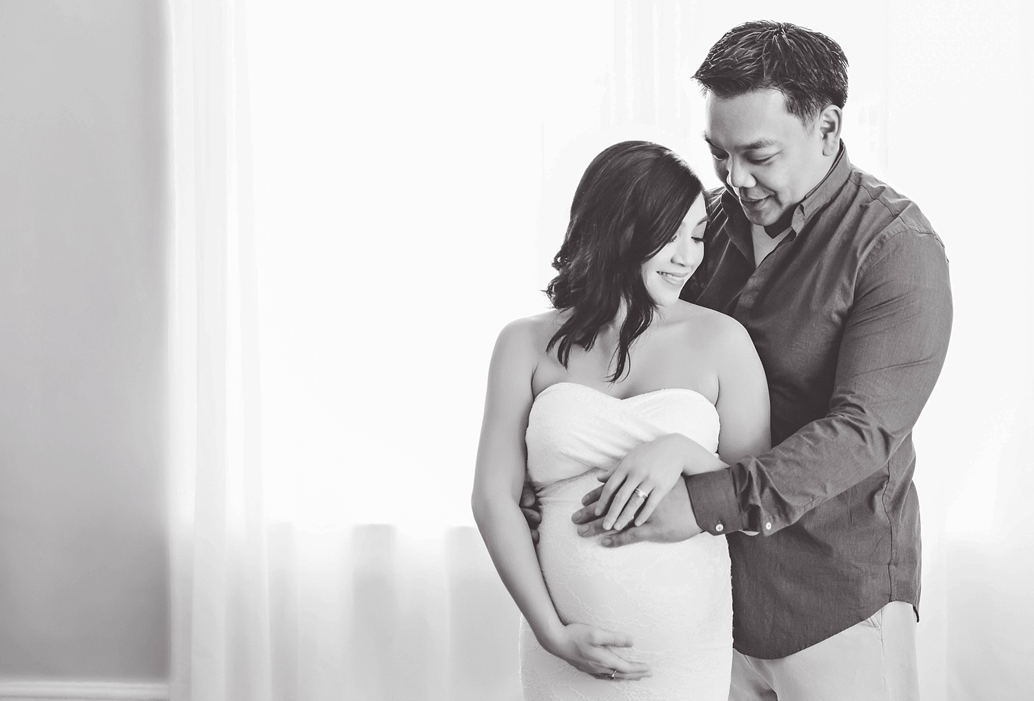  A black and white image of an intimate moment between Asian couple during their Atlanta maternity session.&nbsp; 