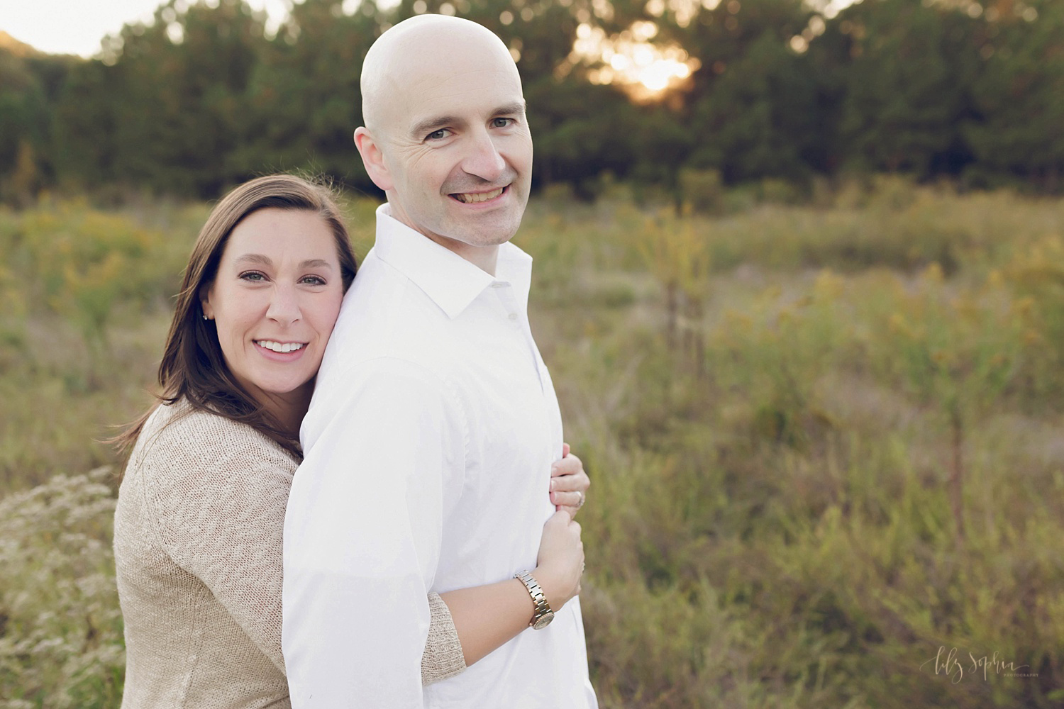  A couples picture of a mom and dad taken by Lily Sophia Photography of Atlanta, GA during a family portrait session.&nbsp; 