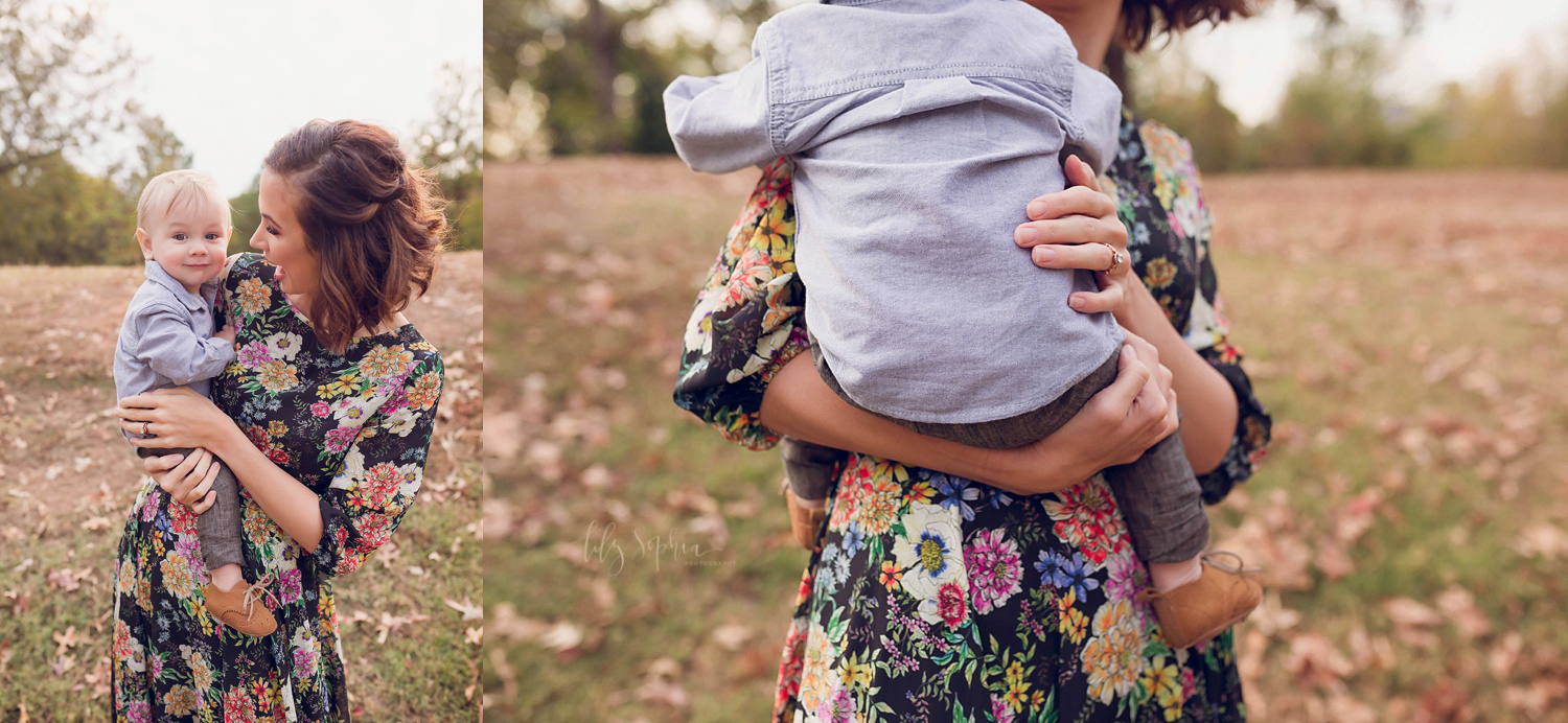  A mother in a floral dress holding her baby boy at sunset in Atlanta, GA. 