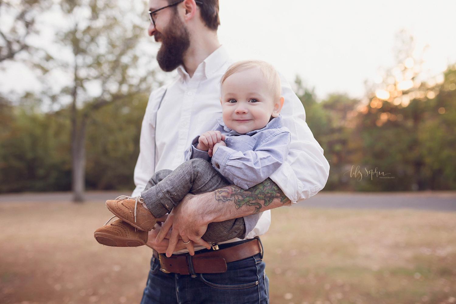  A little boy looking at the camera from his father's arms in Atlanta.&nbsp; 