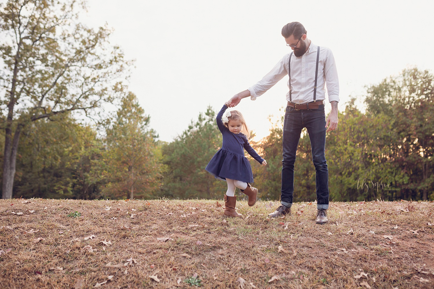  A little girl dances with her father at sunset in Atlanta.&nbsp; 