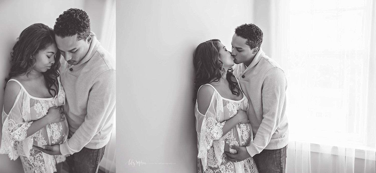  Side by side, black and white images of a pregnant, African American woman and her husband. In the first image, they are looking down at her belly. In the second image, they are kissing.&nbsp; 