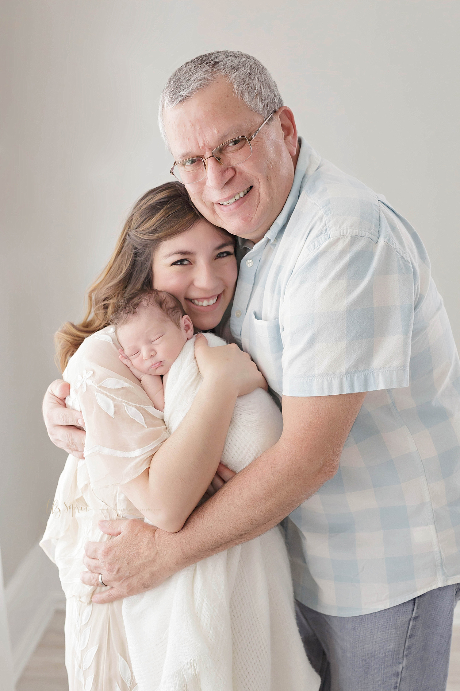  Three generations — grandfather, daughter, and infant son in a studio in Atlanta. 