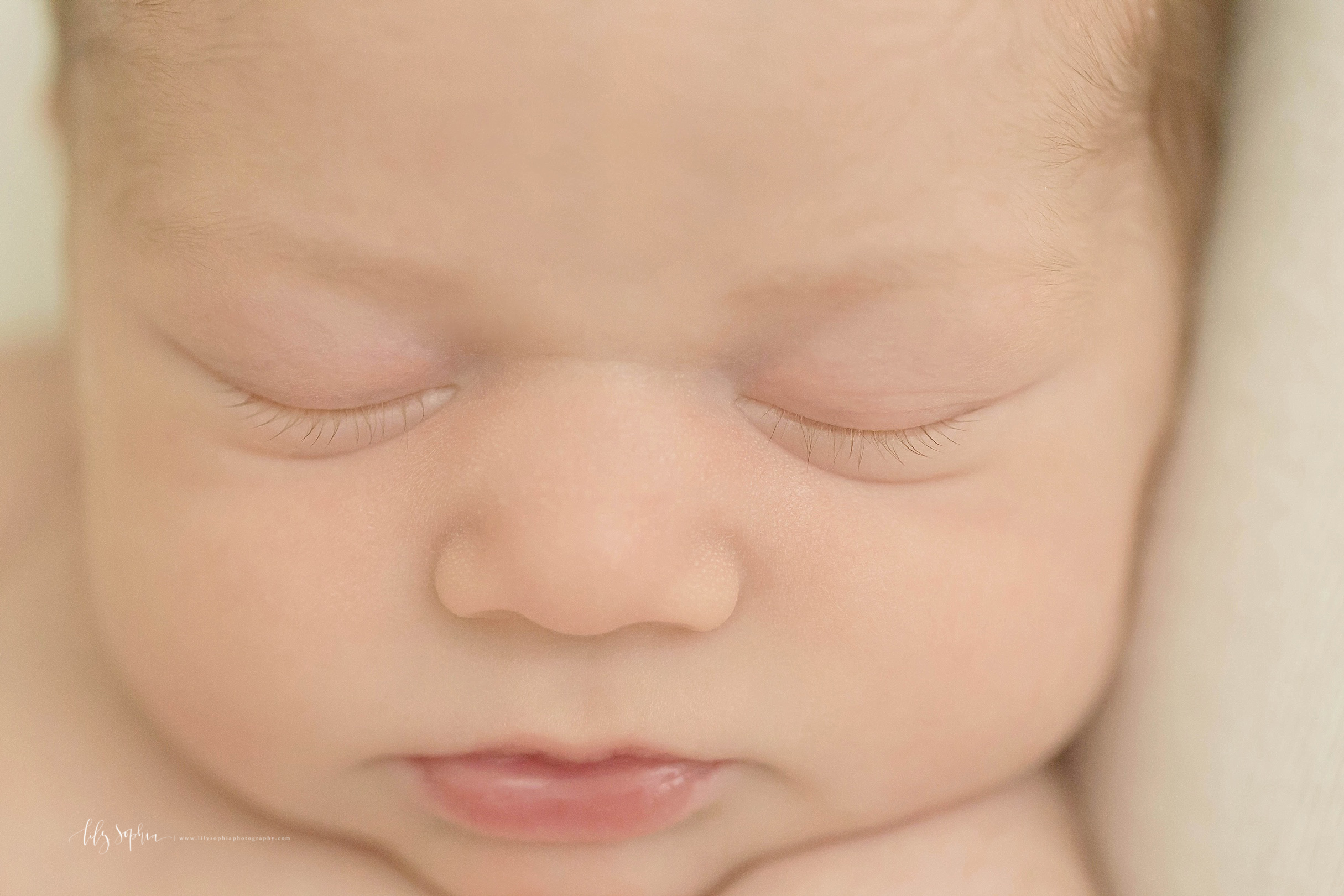 Up close image of a sleeping, newborn,&nbsp;baby's face.&nbsp; 
