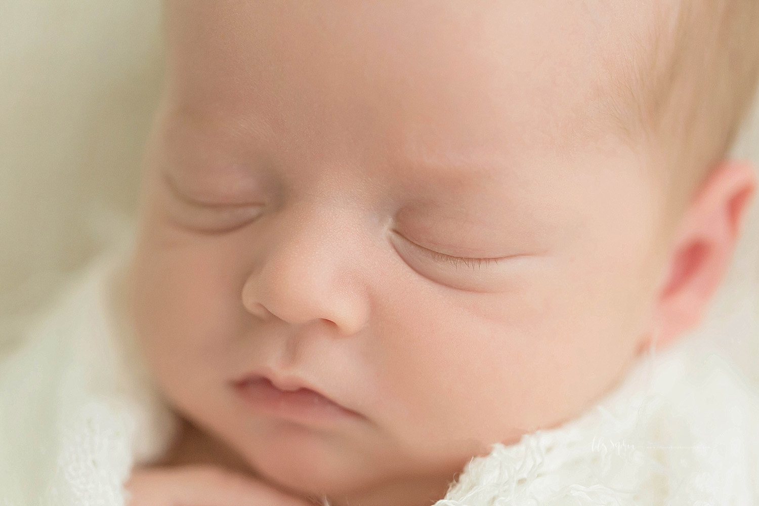  Image of a a sleeping, newborn, baby, boy's eyelashes.&nbsp; 