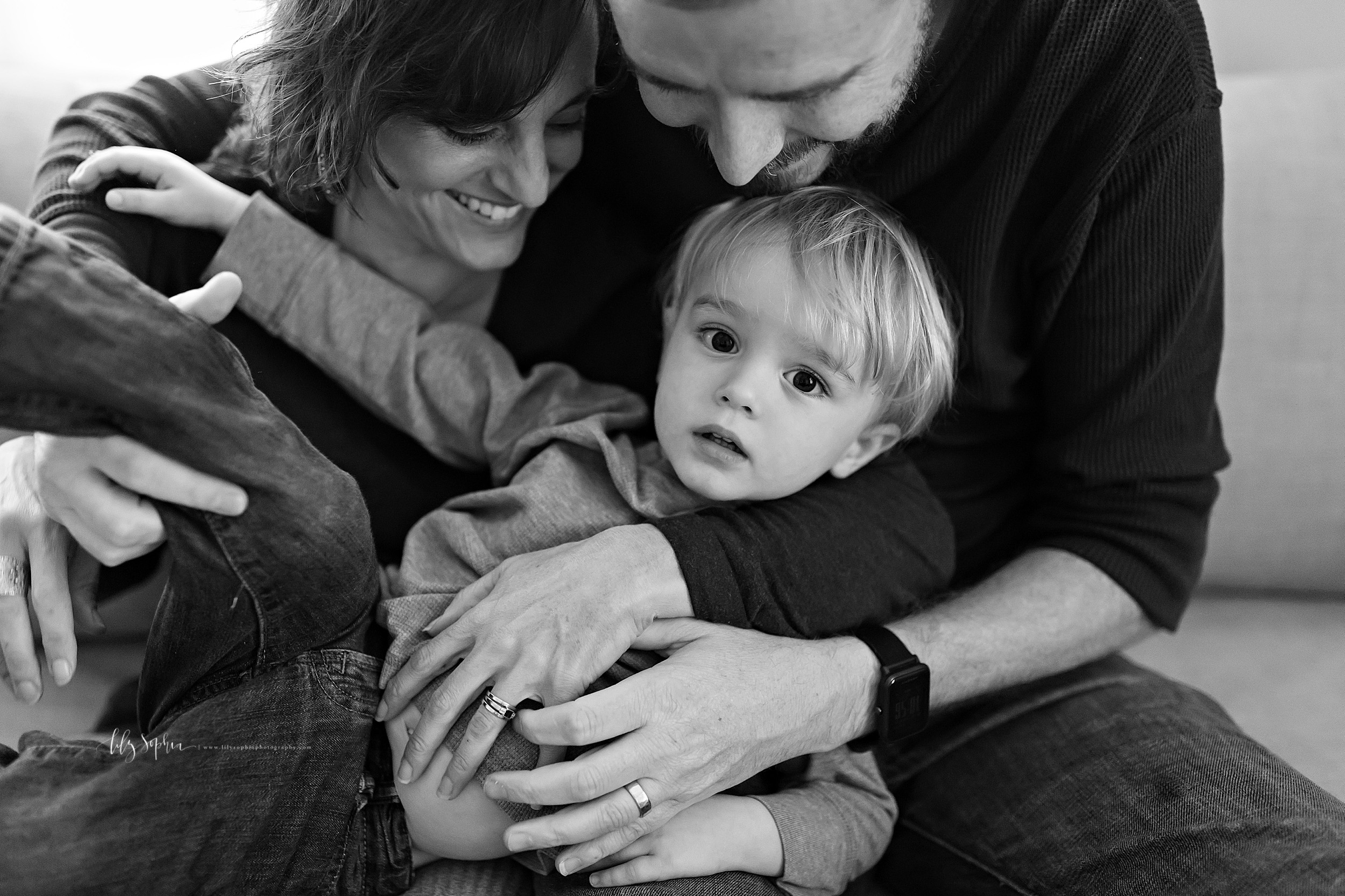  Lifestyle photo of a family of three in their home in Adair Park, Georgia. 