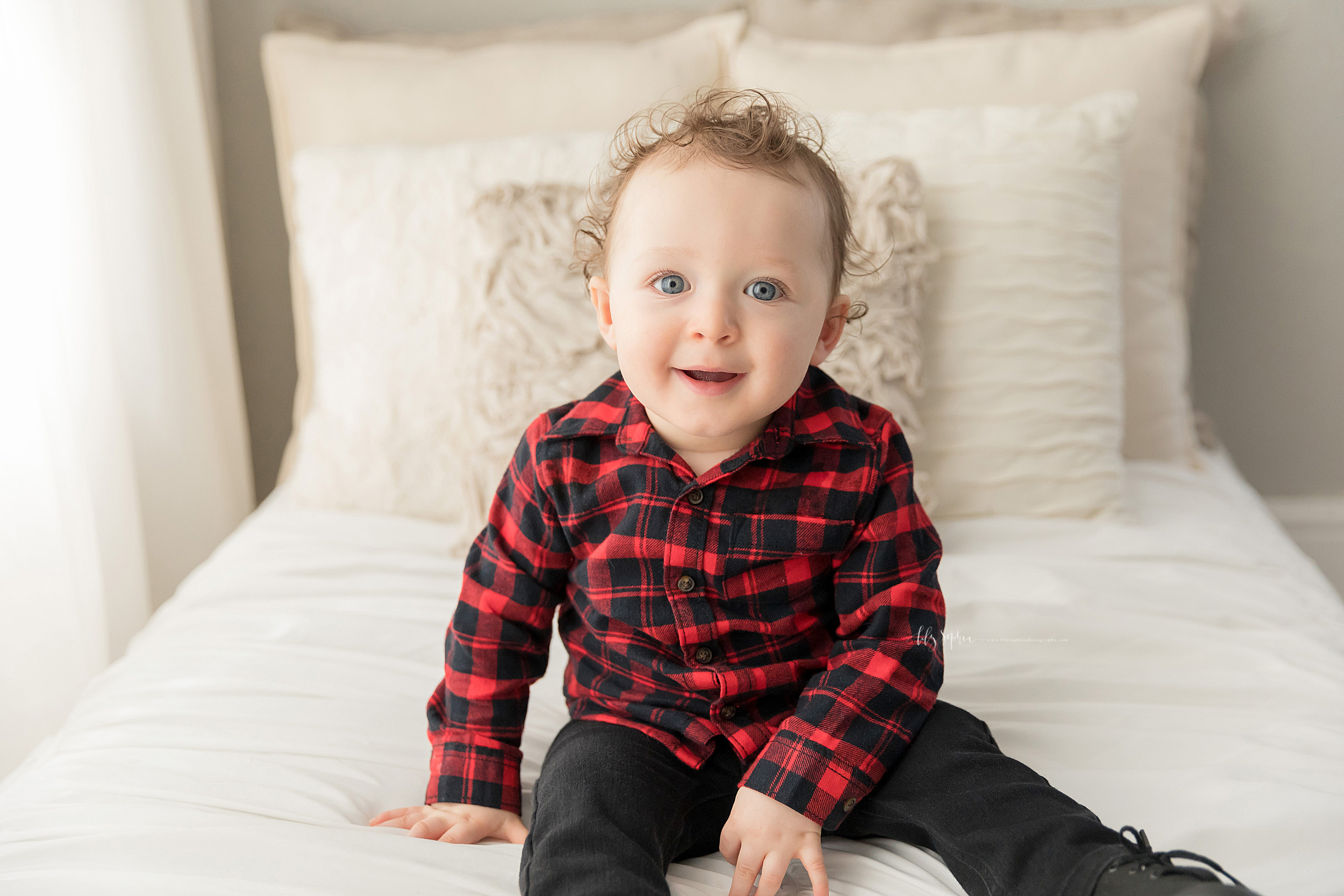  Milestone photo of a boy on his first birthday in an Atlanta natural light studio. 